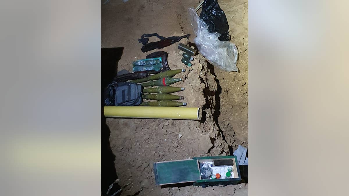 Israeli forces uncovered a Hamas tunnel underneath a building they raided. Inside, they found explosives and other weapons.