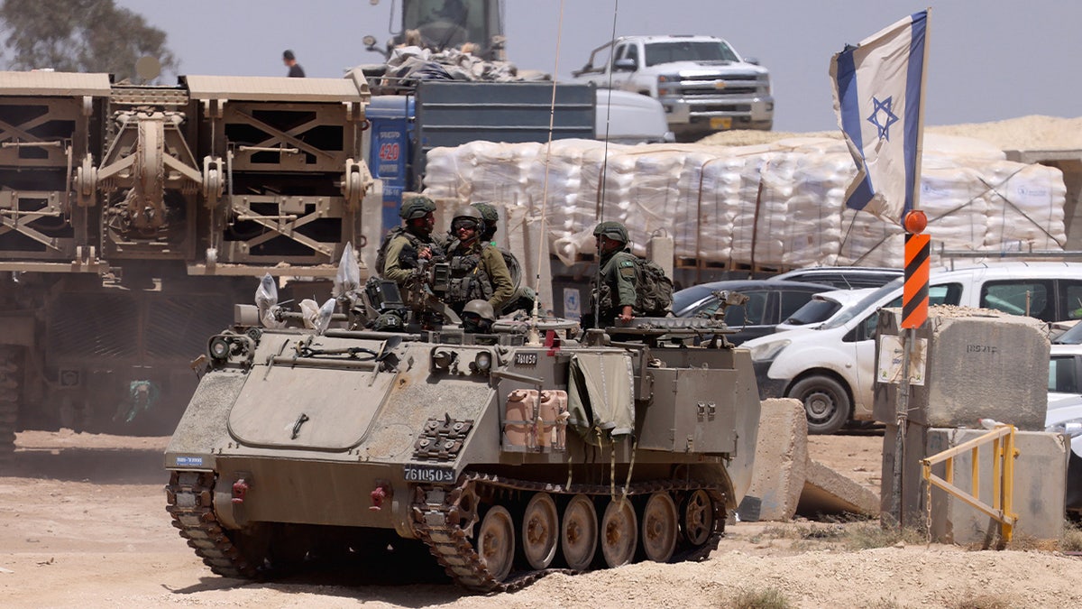 This picture taken from Israel's southern border with the Gaza Strip shows Israeli military vehicles along the border with the Palestinian territory on April 24, 2024, amid the ongoing conflict between Israel and the militant group Hamas.