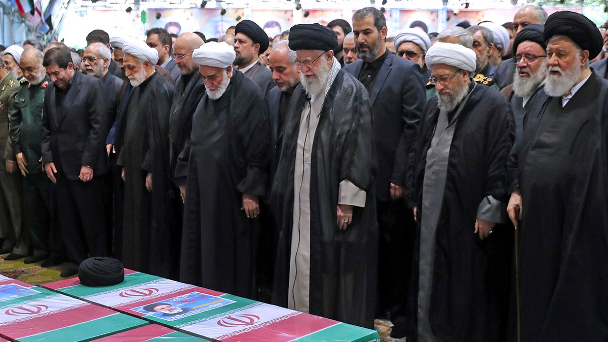 Supreme Leader Ayatollah Ali Khamenei leads mourners in prayer