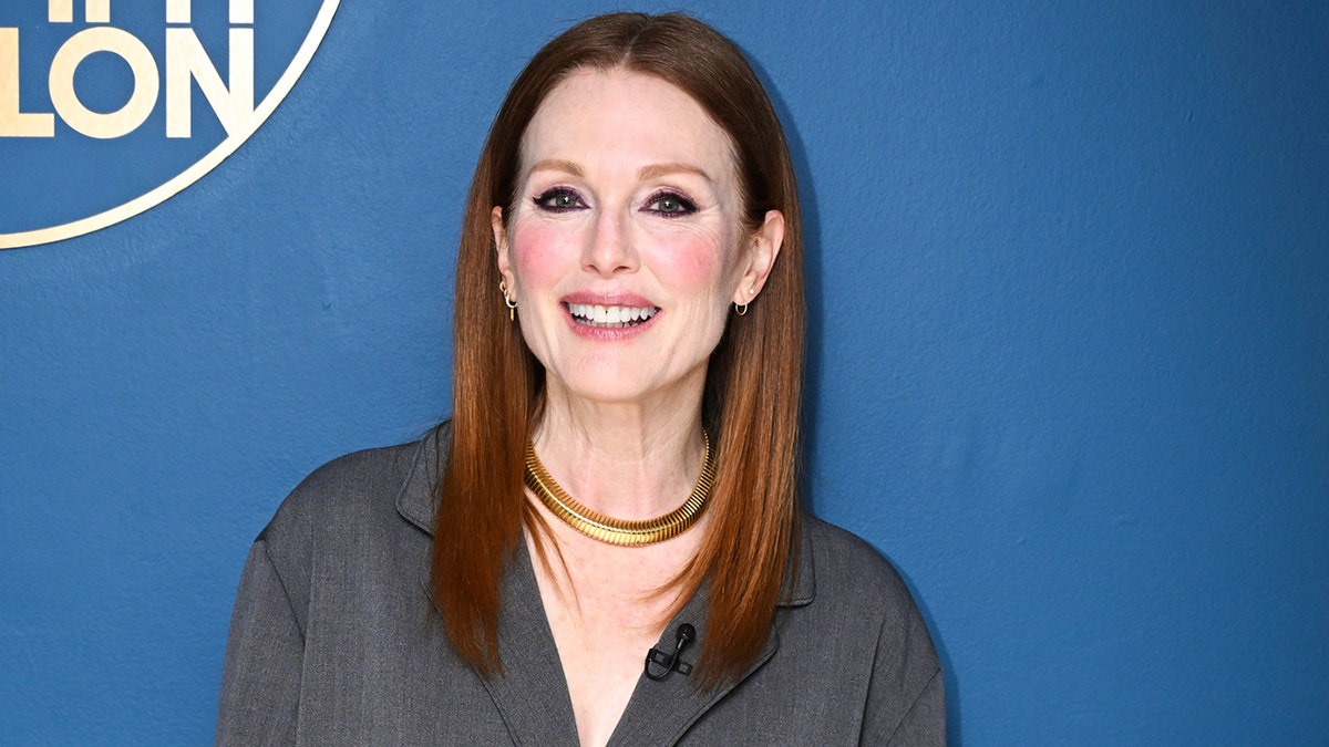 Julianne Moore standing in front of a blue wall