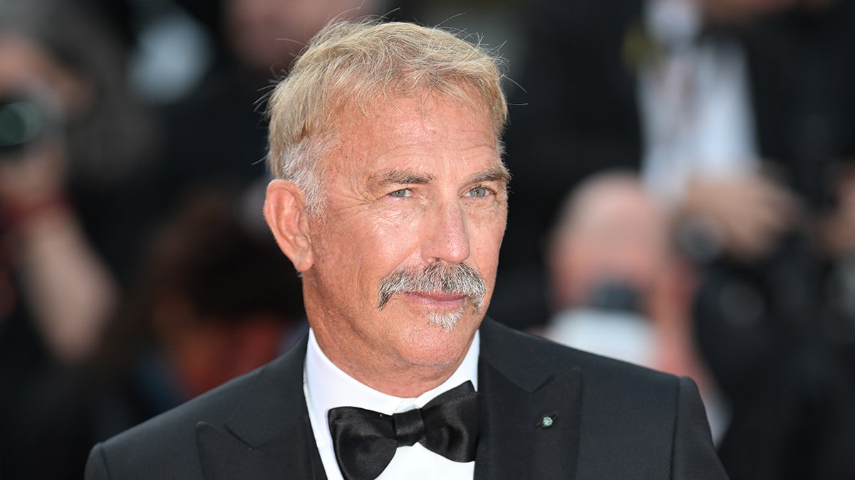 Kevin Costner sports black bow tie and suit at Cannes Horizon premiere.