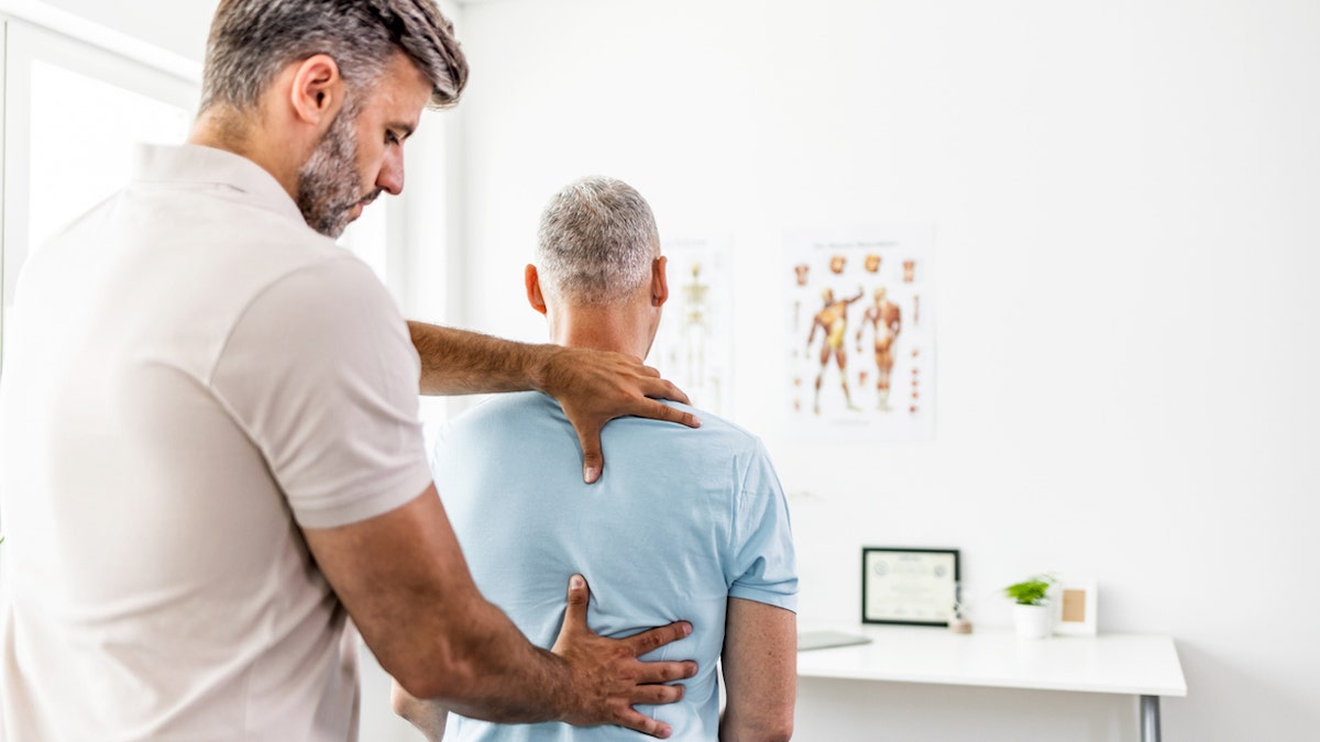 Man at chiropractor