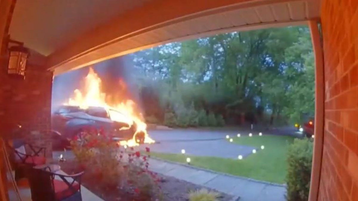 Doorbell camera showing car on fire