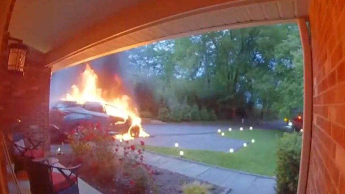 Doorbell camera showing car on fire