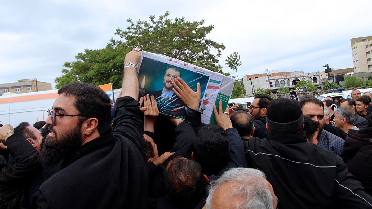 Mourners in black celebrate Raisi's life in Iran
