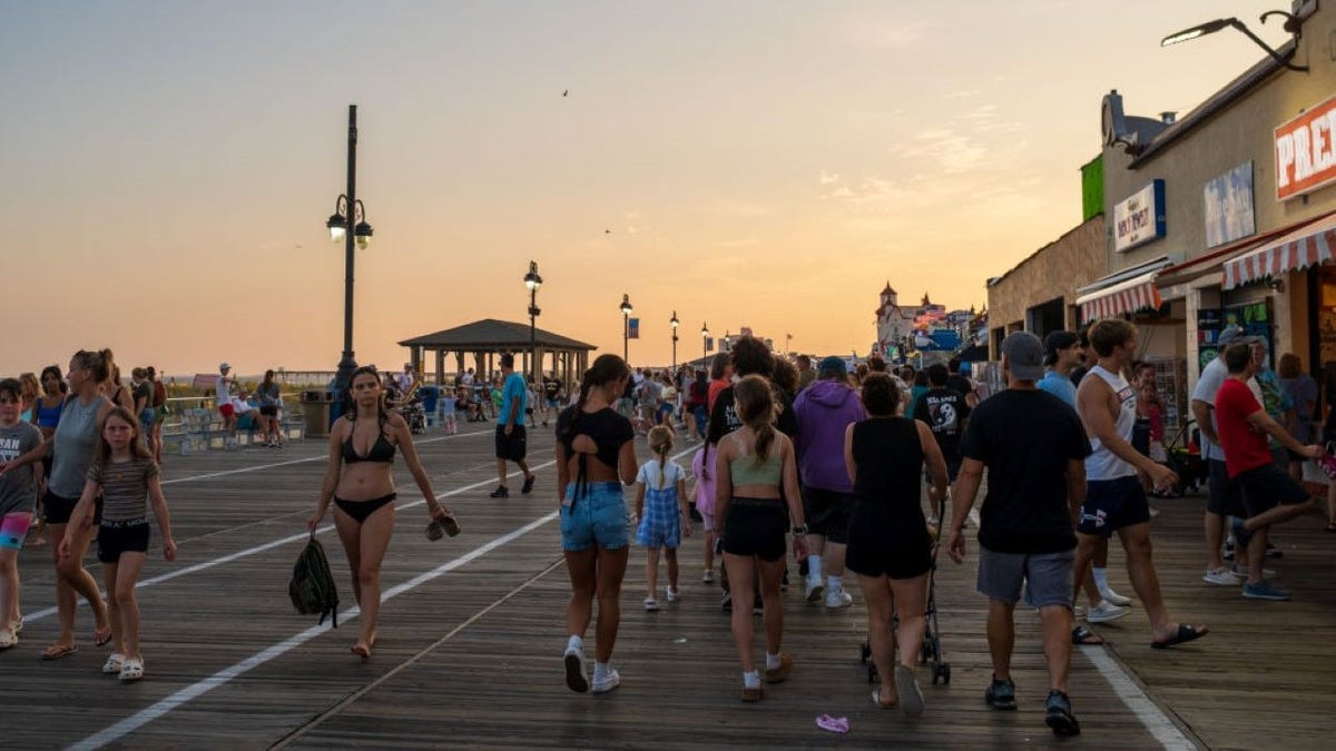 People walk on the Ocean City boardwalk in New Jersey.