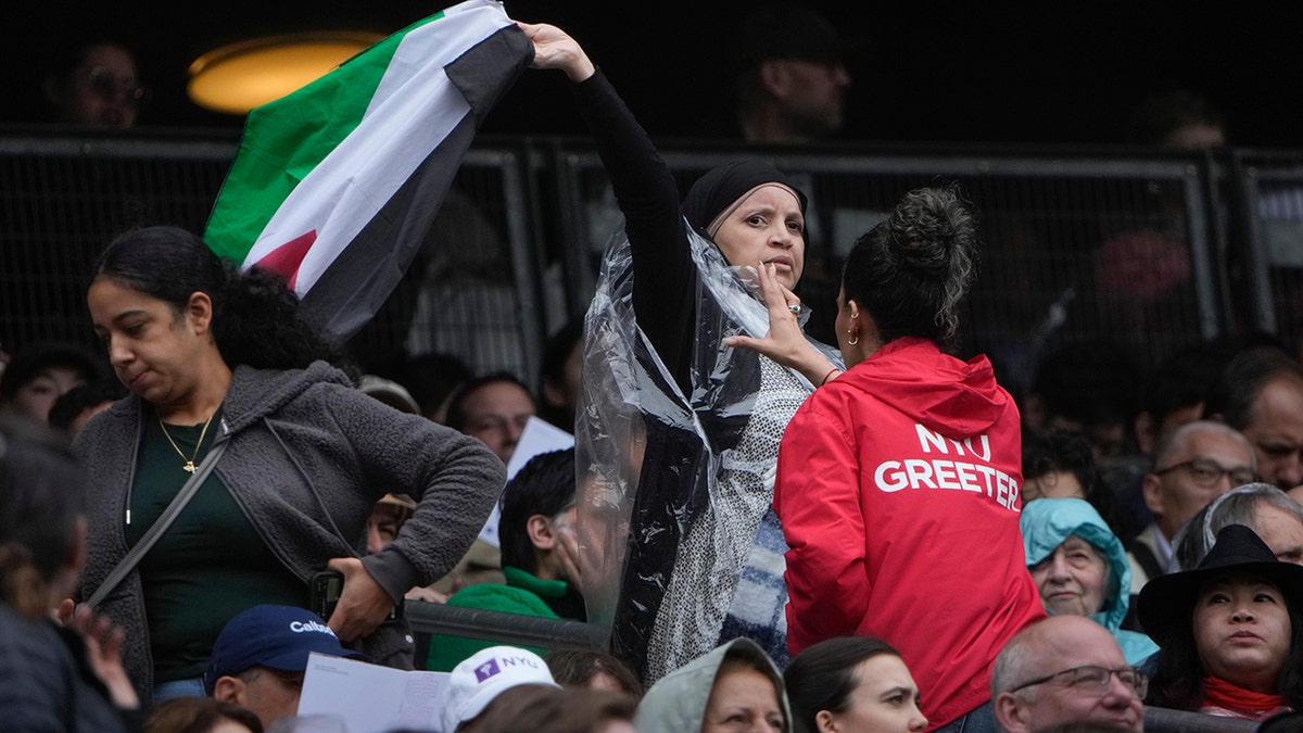 woman waving a Palestinian flag