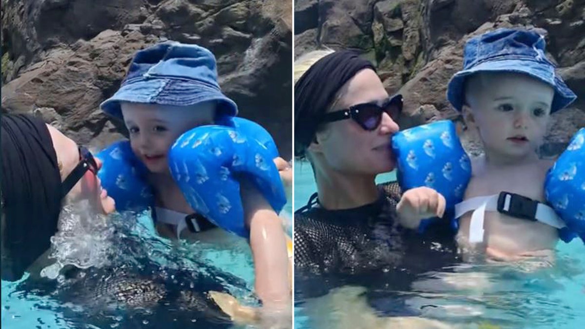 Paris Hilton sports black swimsuit in the pool with her son, Phoenix.