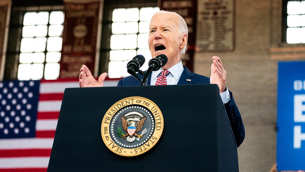 President Joe Biden speaks at podium in Philadelphia