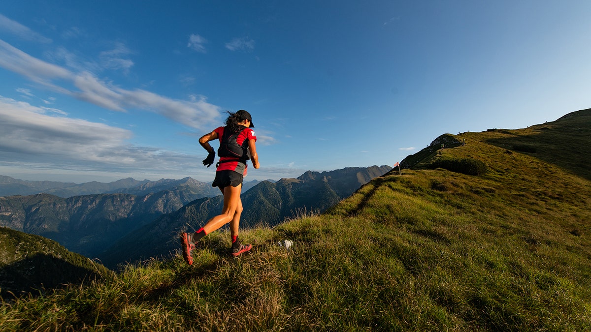 Woman running on a mountain