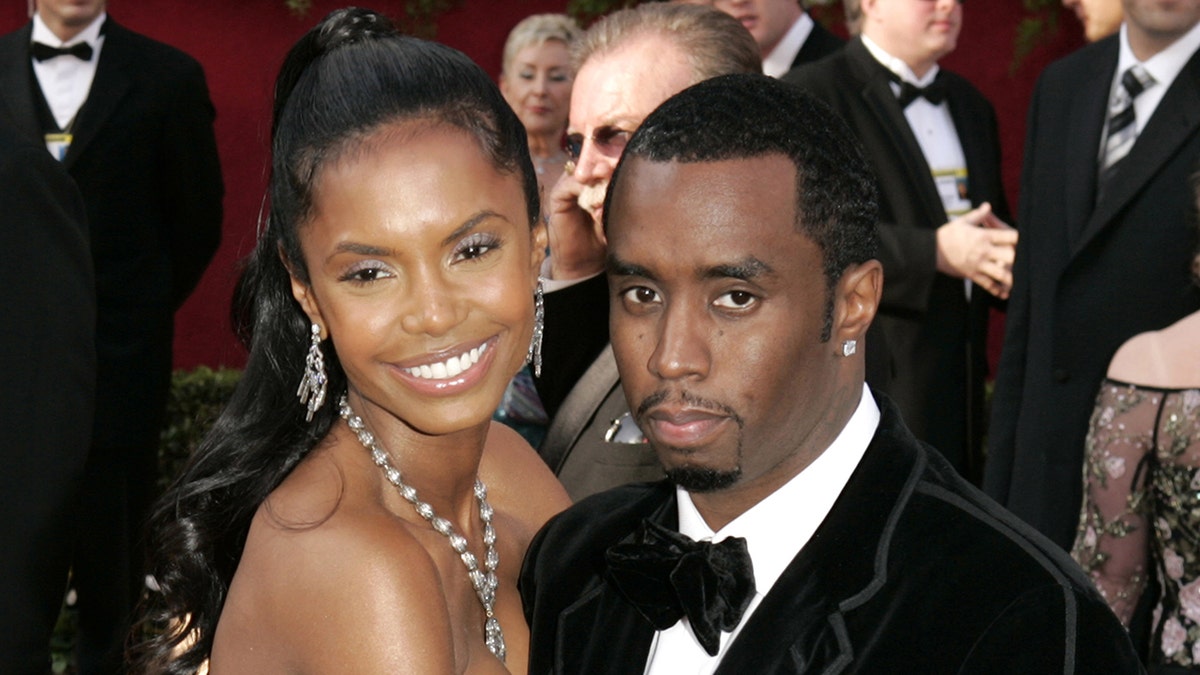 Sean Combs wears velour suit on the Oscars red carpet with Kim Porter.