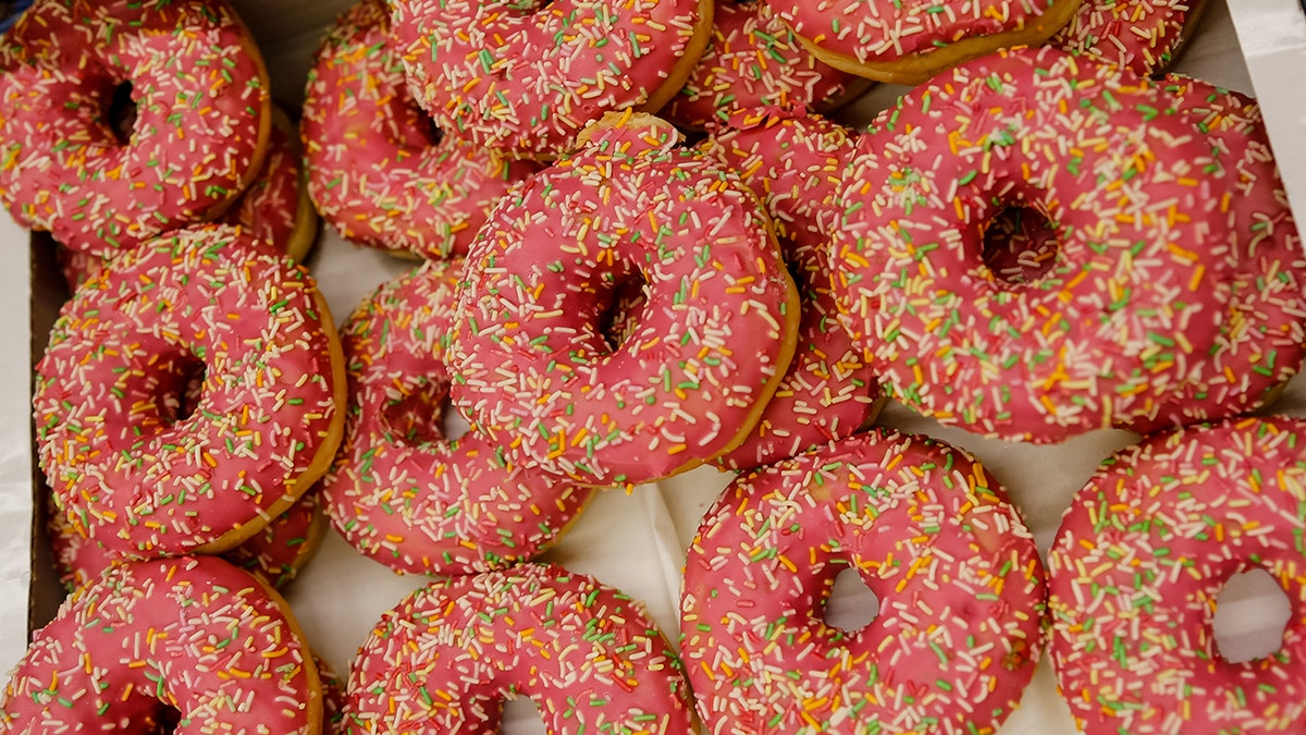An arrangement of sprinkled doughnuts