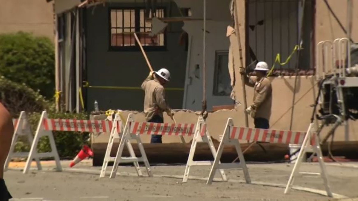 utility workers outside building