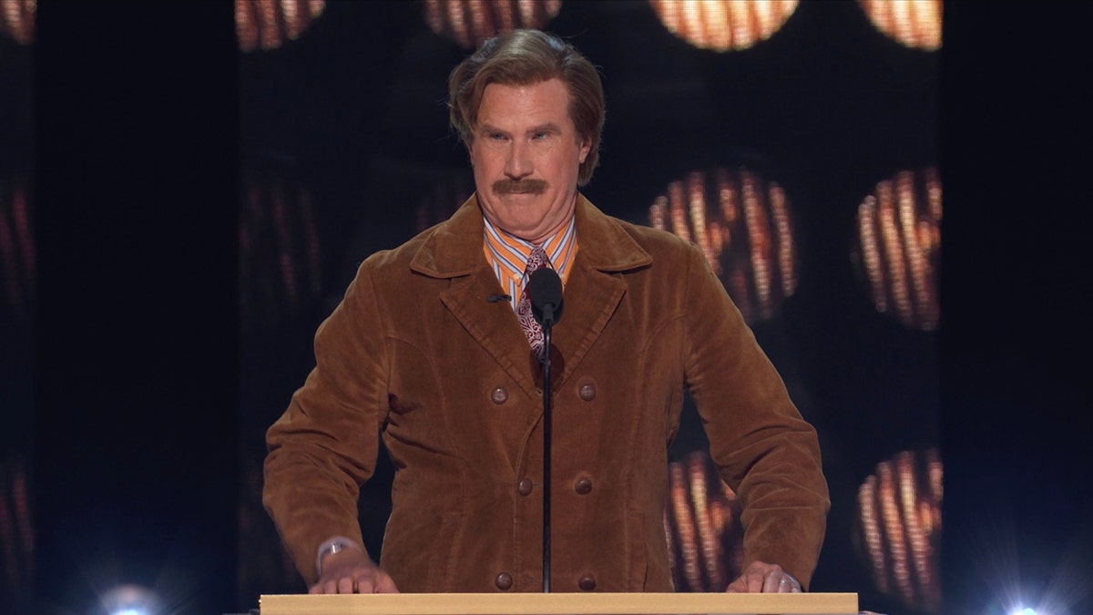 Will Ferrell as his character from "Anchorman" Ron Burgundy in an a brown jacket