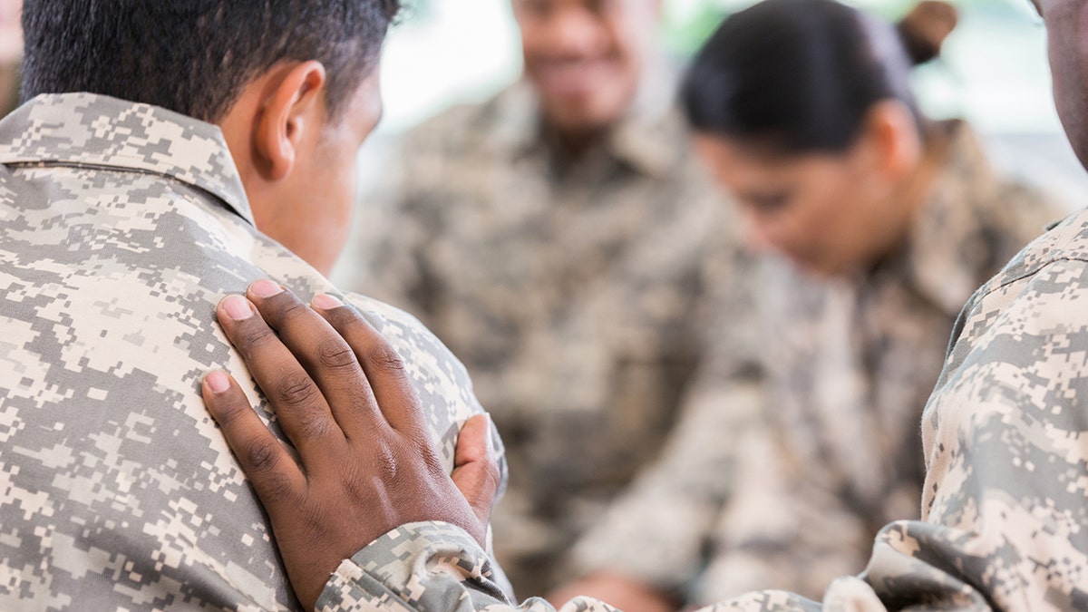 A stock photo shows U.S. veterans in a support group