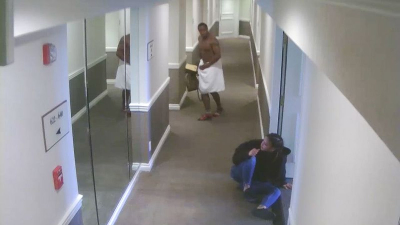 Near-naked rapper seen beating woman on newly released security video