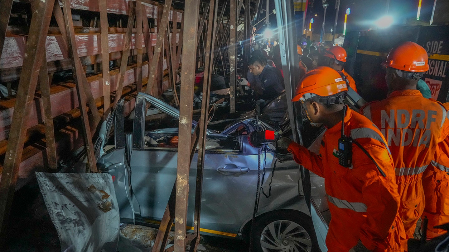 Billboard collapses onto group of pedestrians, killing at least 14