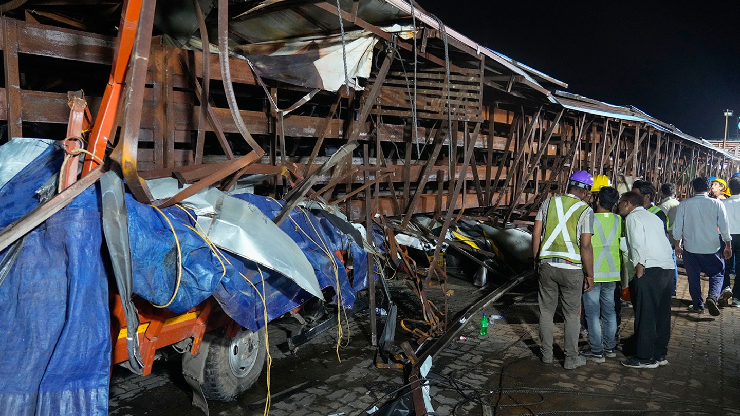 Billboard collapses onto group of pedestrians, killing at least 14