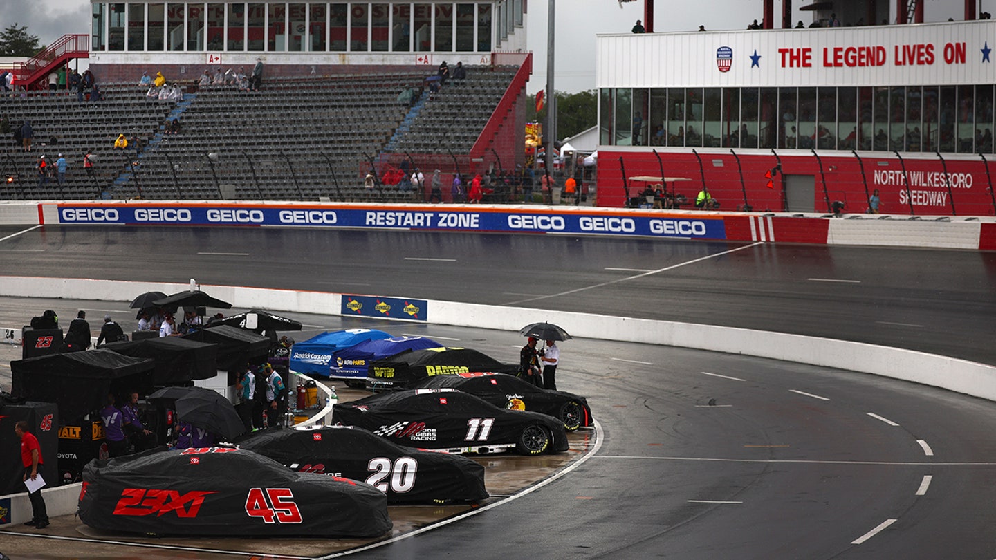 NASCAR Driver Defies Flooded Pit Road with Epic Belly Flop