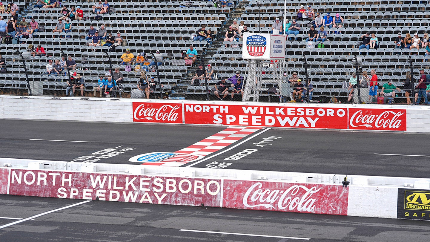 NASCAR Driver Defies Flooded Pit Road with Epic Belly Flop