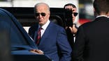 US President Joe Biden listens to a question from reporters before boarding a limousine upon arrival at Seattle-Tacoma International Airport, in SeaTac, Washington, on May 10, 2024. (Photo by Mandel NGAN / AFP) (Photo by MANDEL NGAN/AFP via Getty Images)