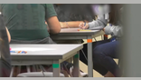 students working at a desk