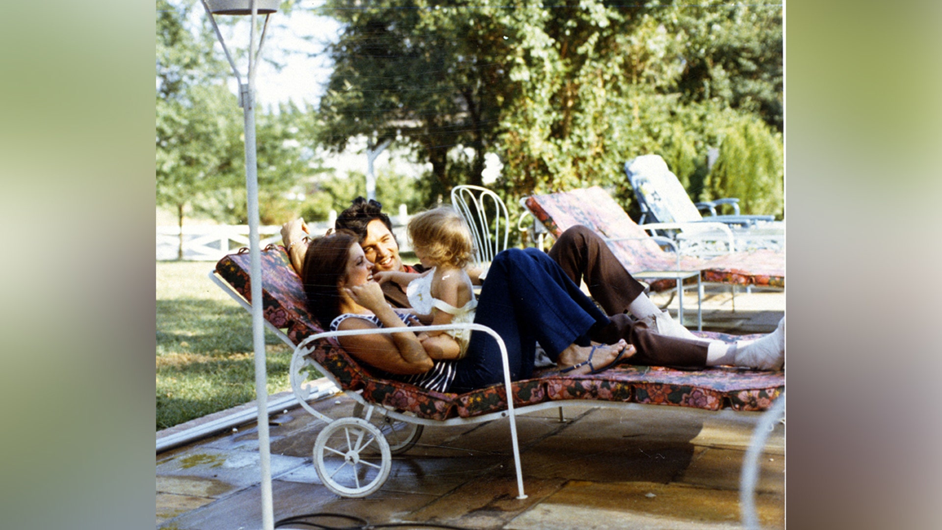Elvis Presley, Lisa Marie and Priscilla outside