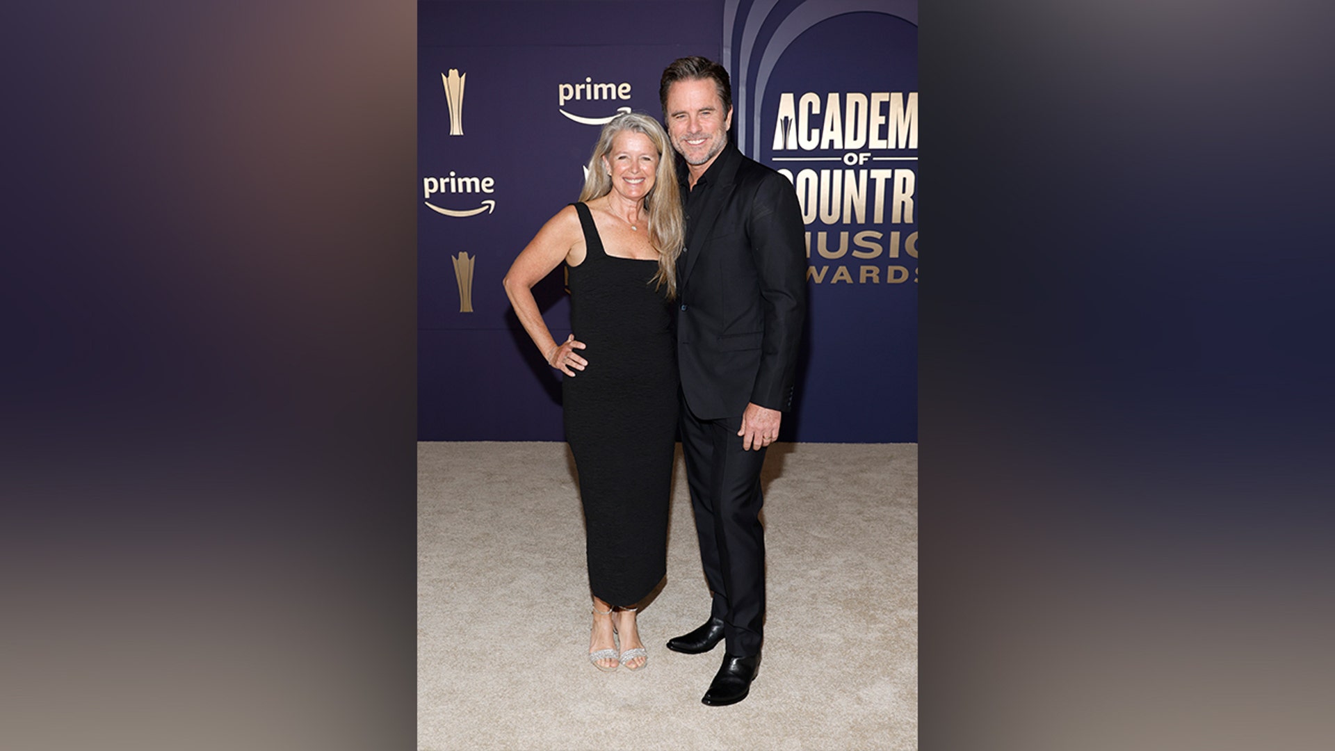 Patty Hanson Puskar and Charles Esten matching in black at ACM Awards