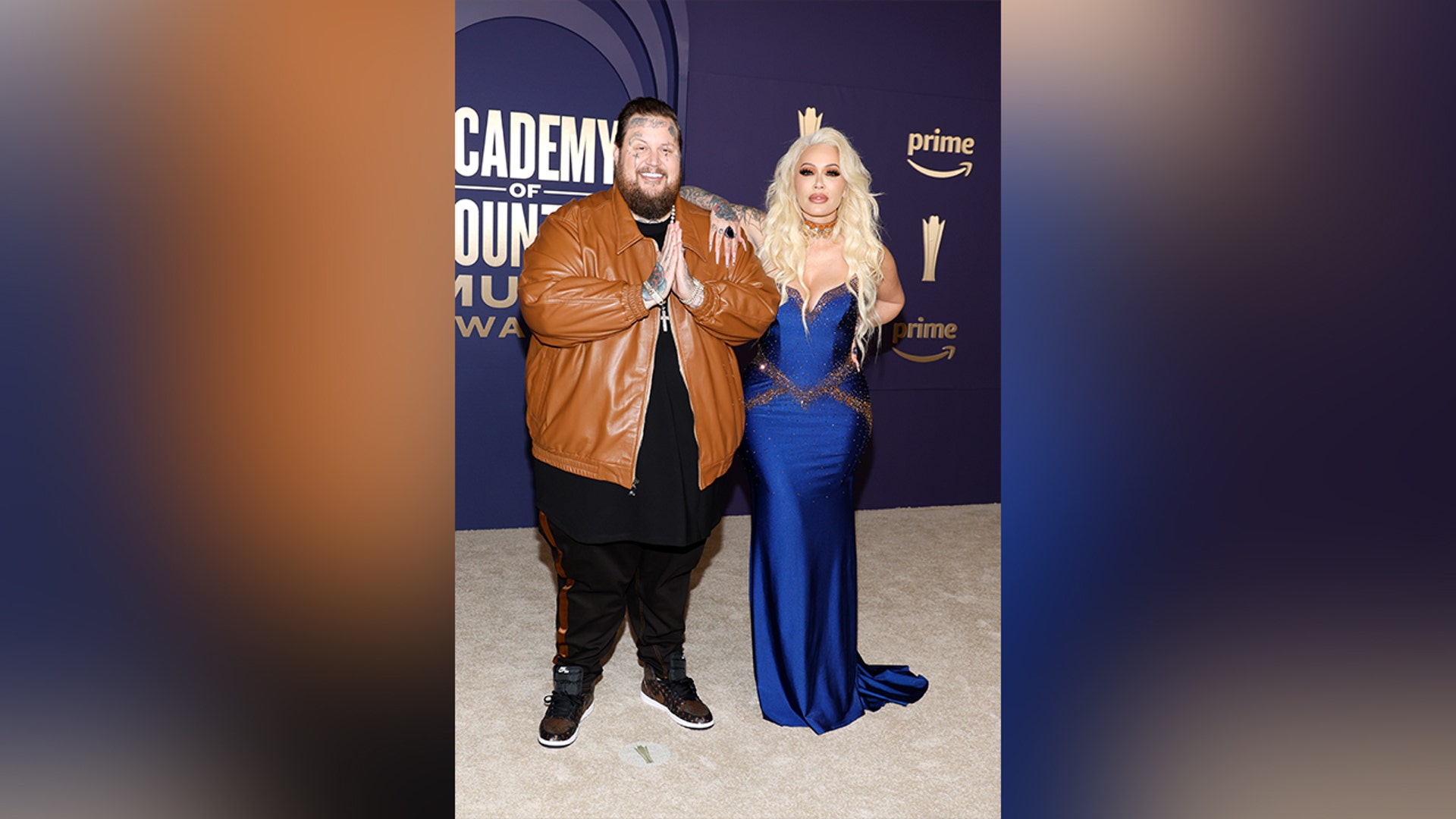 Jelly Roll and Bunnie XO in a blue gown