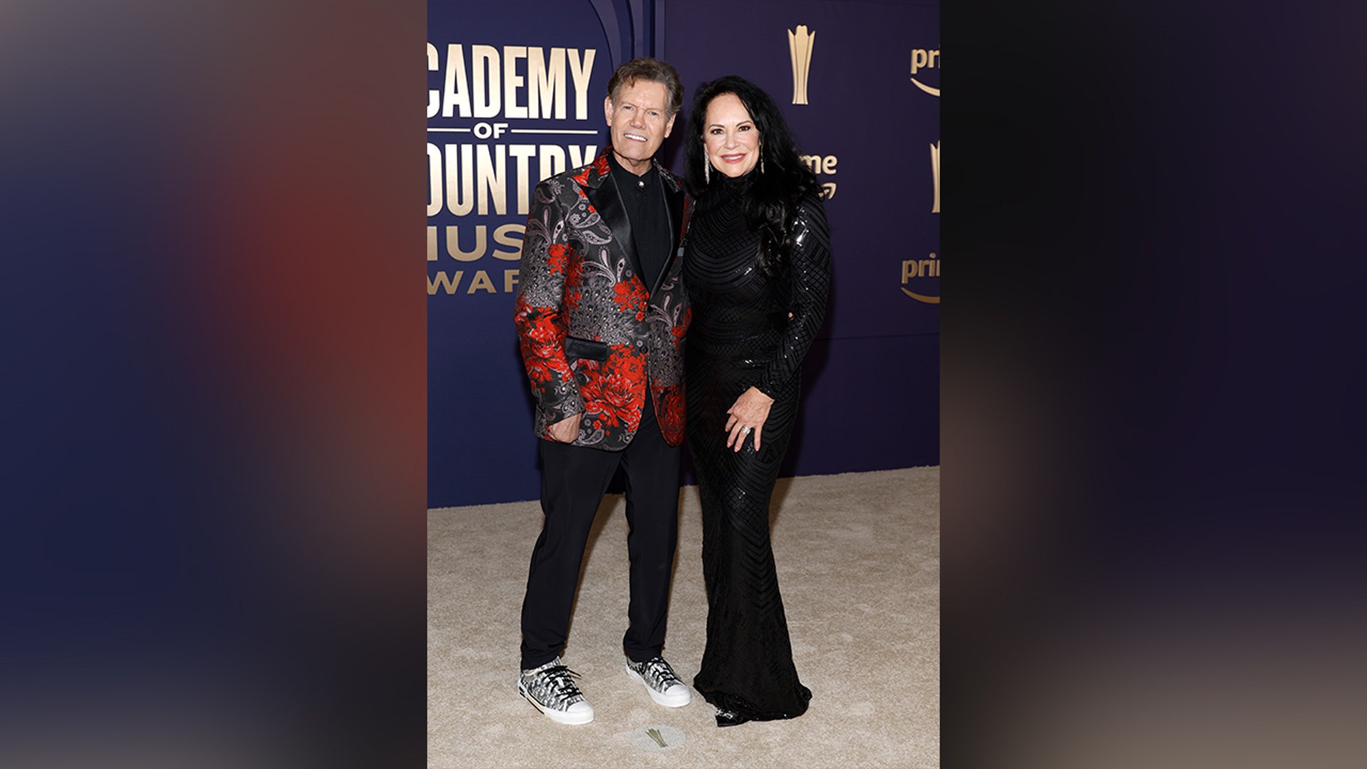 Randy Travis and Mary Davis in black at ACMs