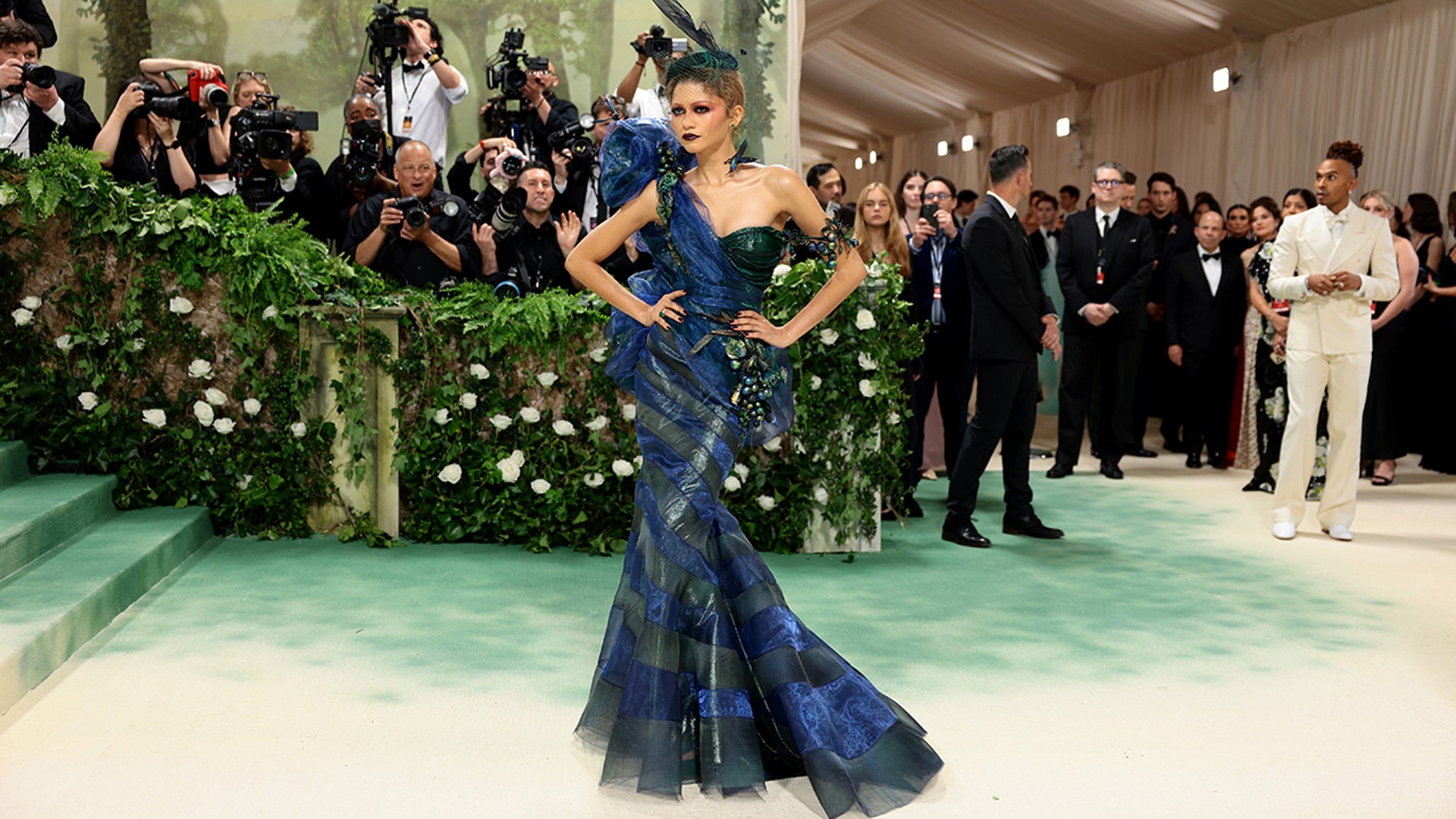 Actress Zendaya sports royal blue and green gown at the 2024 Met Gala.