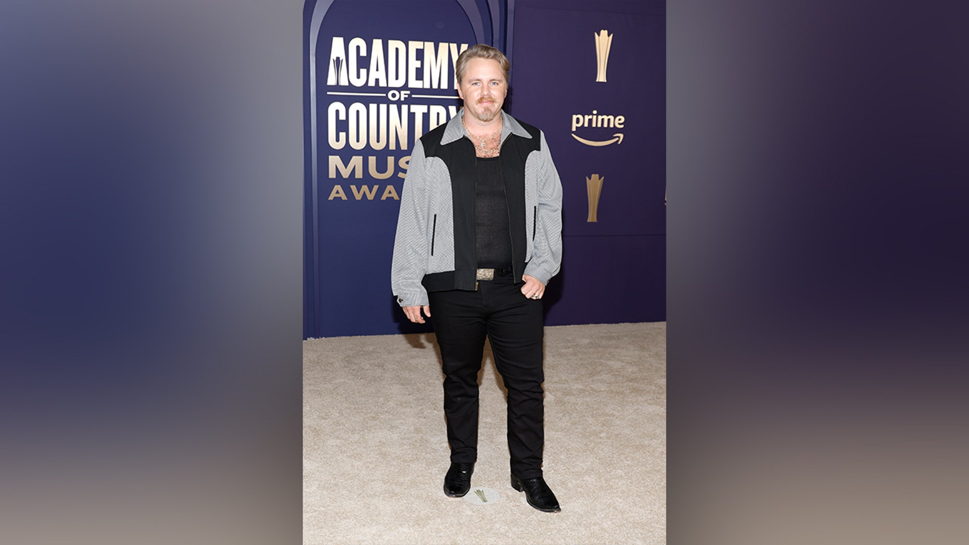 Ernest in black and gray ACM Awards