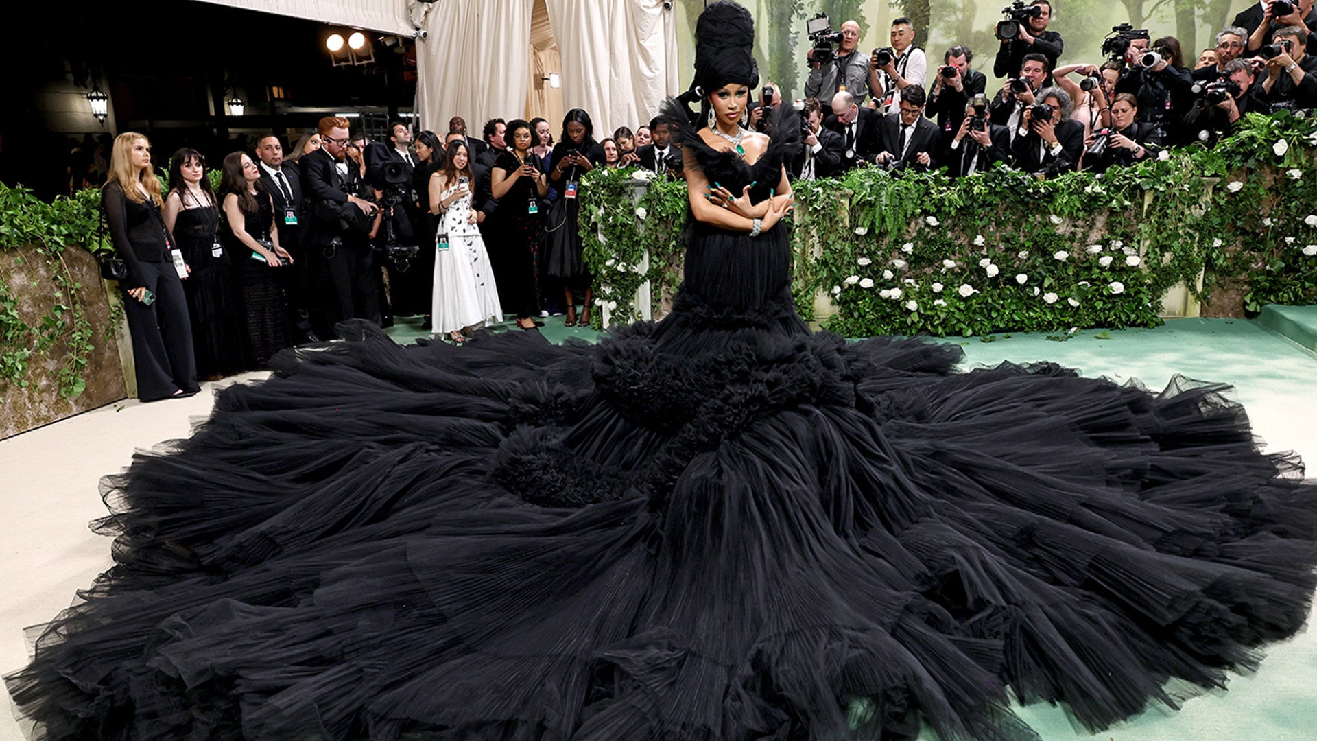 Cardi B at the Met Gala 2024 red carpet wearing a voluminous black tulle ball gown.