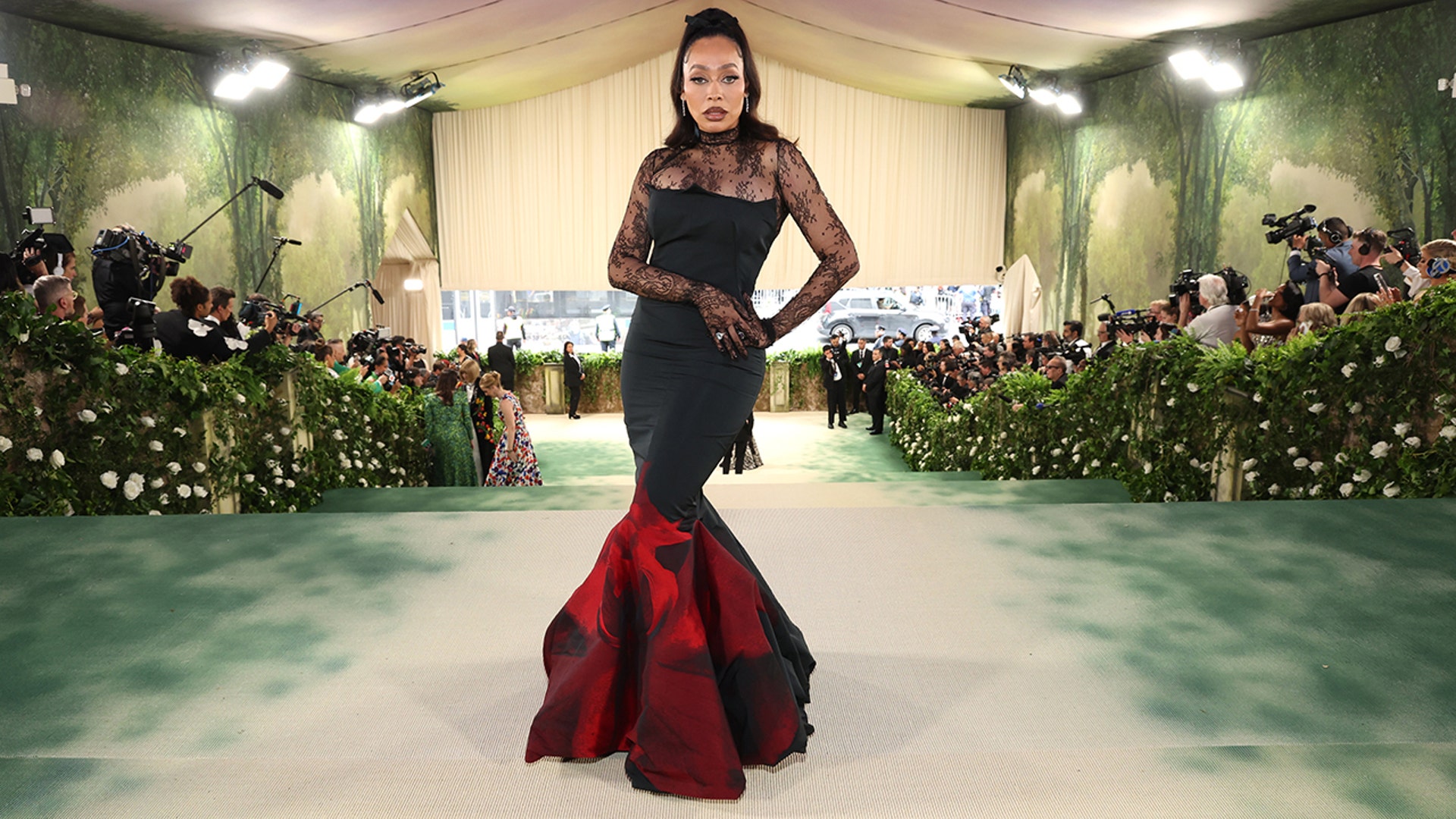 Lala Anthony wore sheer black dress with red skirt to Met Gala.