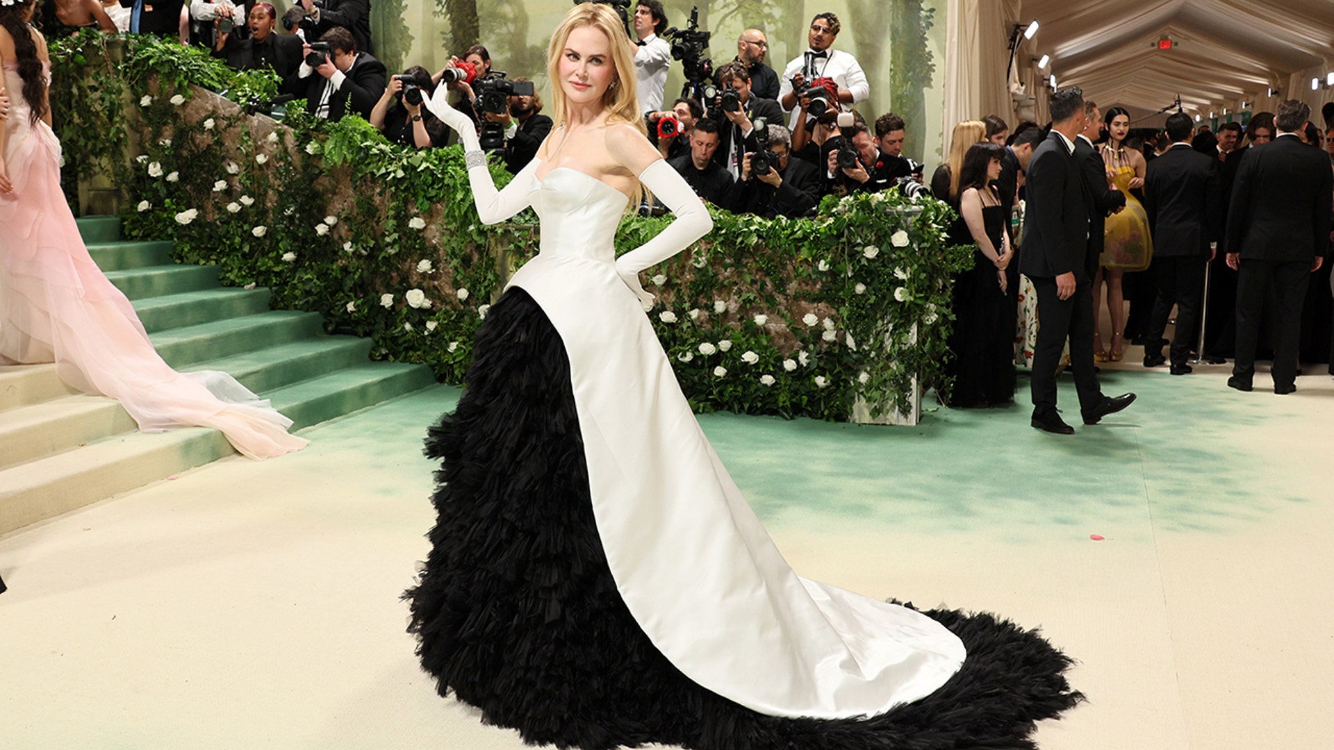 Actress Nicole Kidman wears a strapless white gown with black lace skirt to Met Gala in New York.