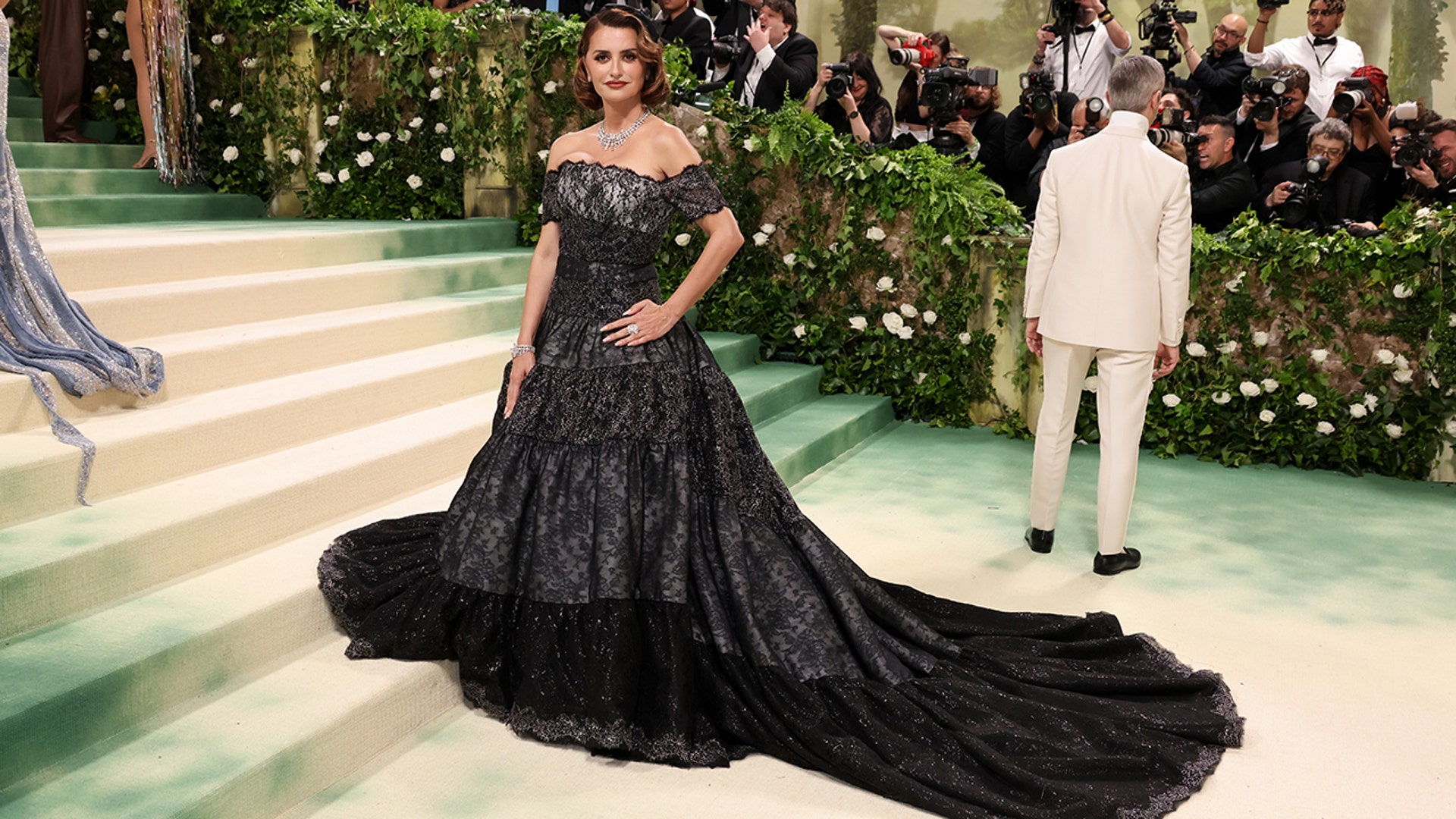 Penelope Cruz at the Met Gala 2024 red carpet in a black lace Chanel Haute Couture.