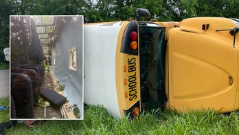 Kentucky school bus flips on its side with 23 children inside