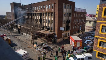 Building fire that killed 76 in South Africa was caused by building negligence, report says