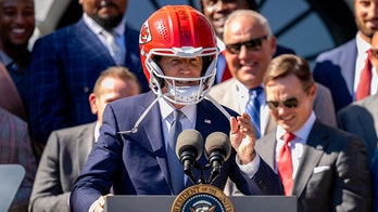 President Biden tries on Chiefs helmet; Travis Kelce jokes about last year's antics during White House visit