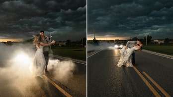 Kansas photographer turns dramatic thunderstorm into stunning backdrop for bride and groom