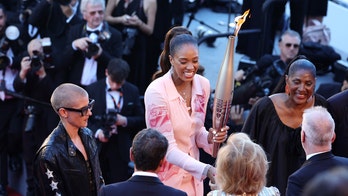 Olympic torch graces the Cannes red carpet during 'Marcello Mio' premiere