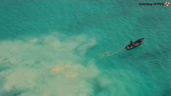 Philippines accuses China of pillaging giant clams in disputed shoal