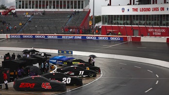 NASCAR driver belly-flops into massive flood on pit road as rain postpones race