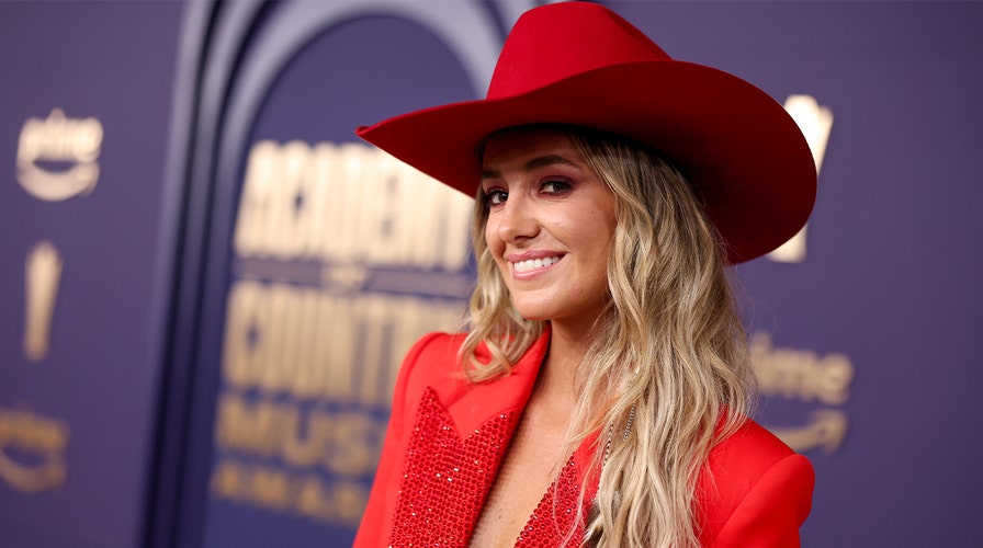 Lainey Wilson walks the red carpet at the 2024 ACM Awards