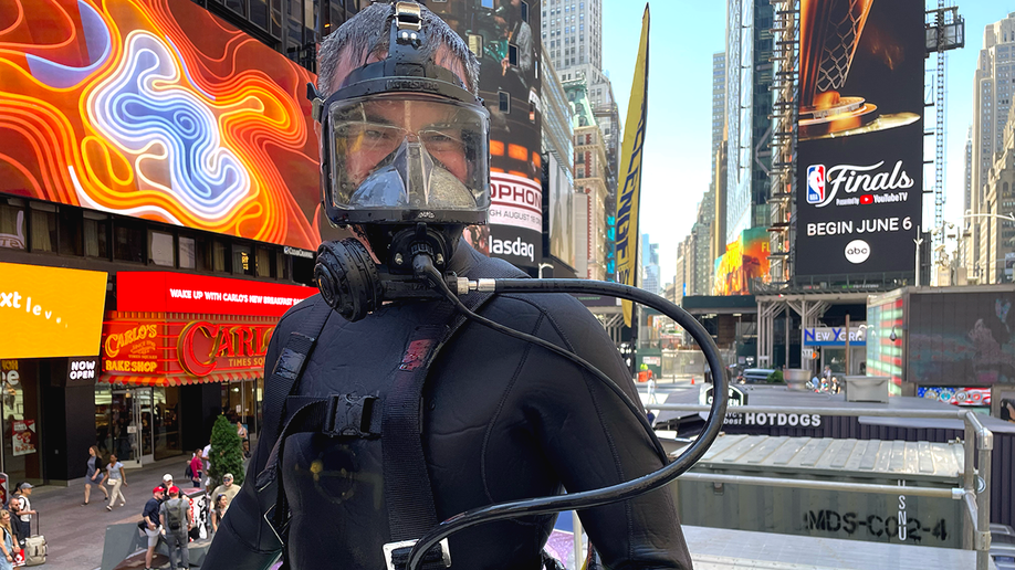 navy diver in gear in times square