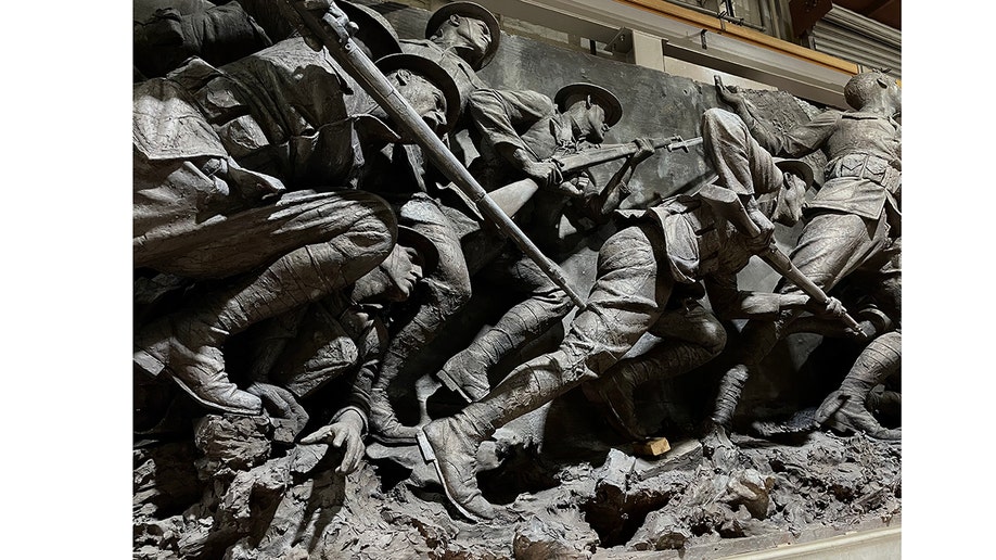 WWI soldiers depicted at battle in a sculpture