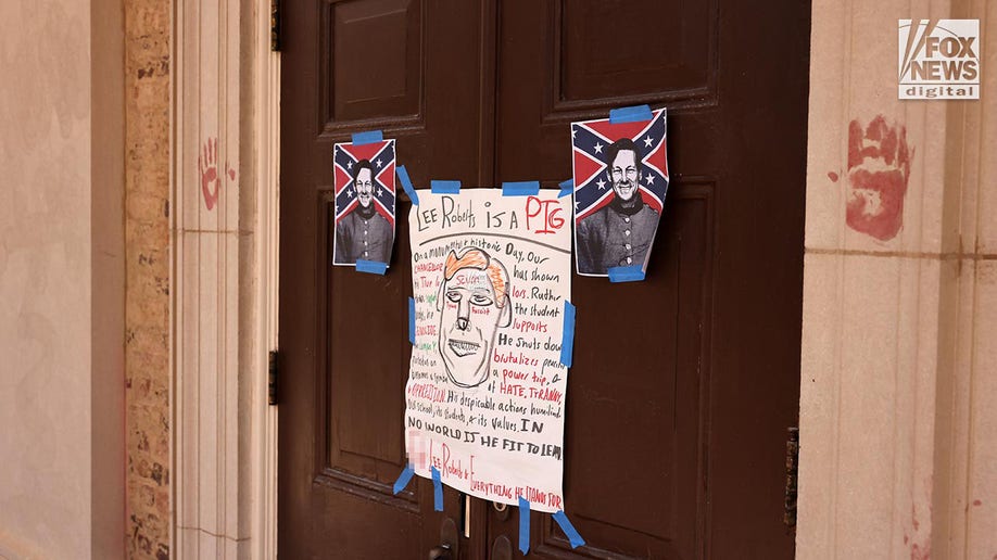 Signs posted to the door depict Chancellor Roberts as a Confederate