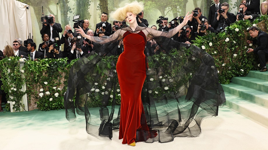 Gwendoline Christie wears red velvet dress at the met gala