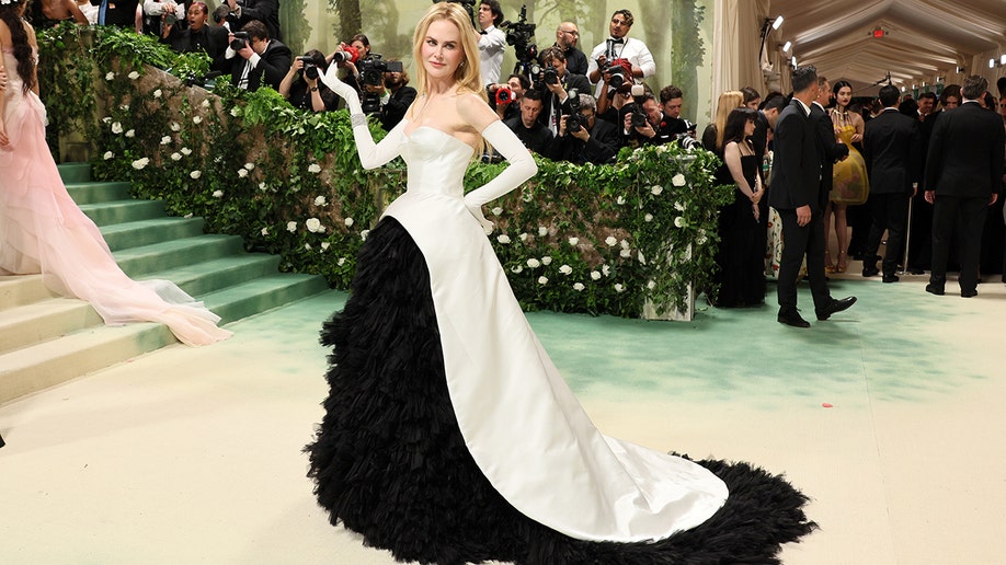 Actress Nicole Kidman wears a strapless white gown with black lace skirt to Met Gala in New York.