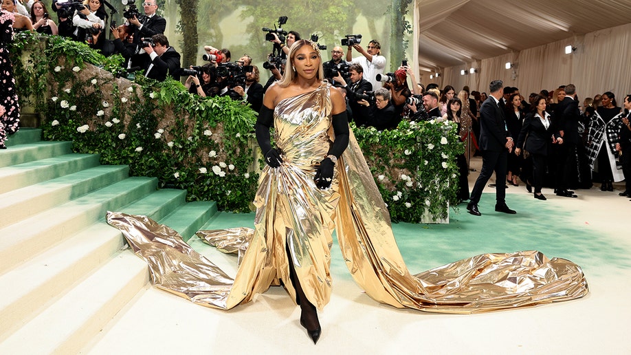 Serena Williams sports gold at the Met Gala red carpet.